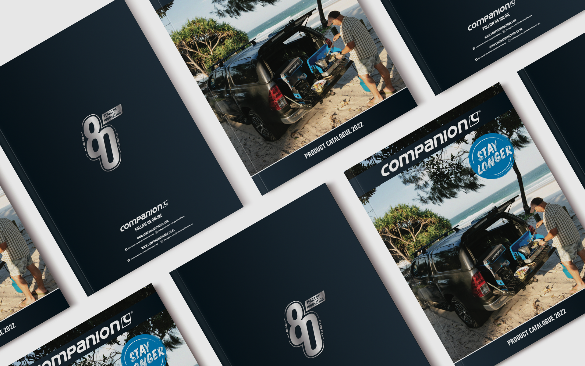 A bunch of brochures are sitting on top of each other on a table.