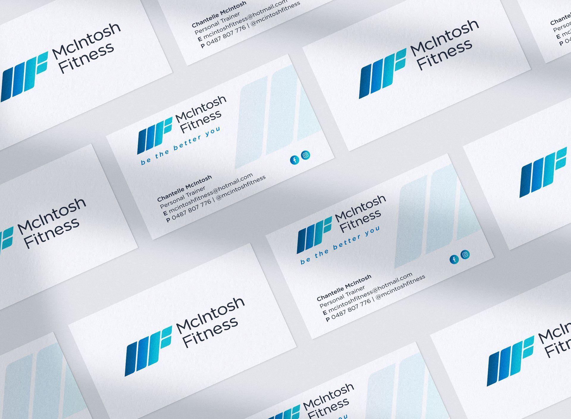 A stack of business cards for mcintosh fitness