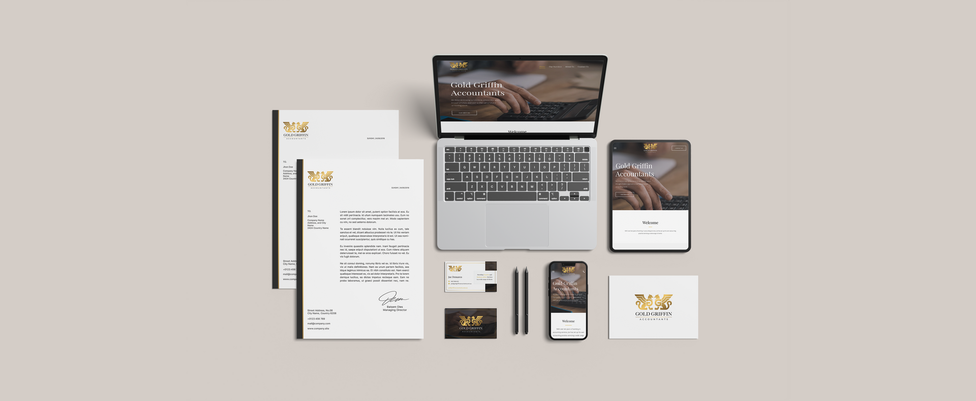 A laptop computer is sitting on top of a table next to a bunch of papers.