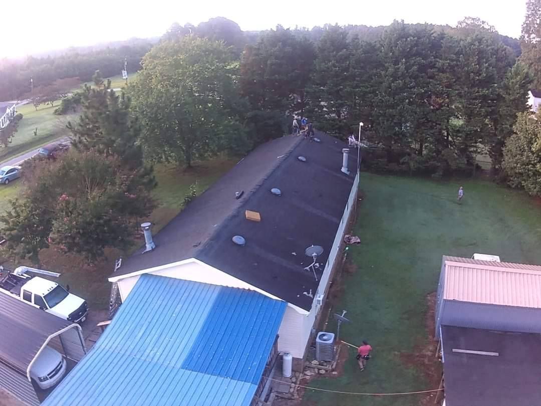 An aerial view of a house with a blue roof.