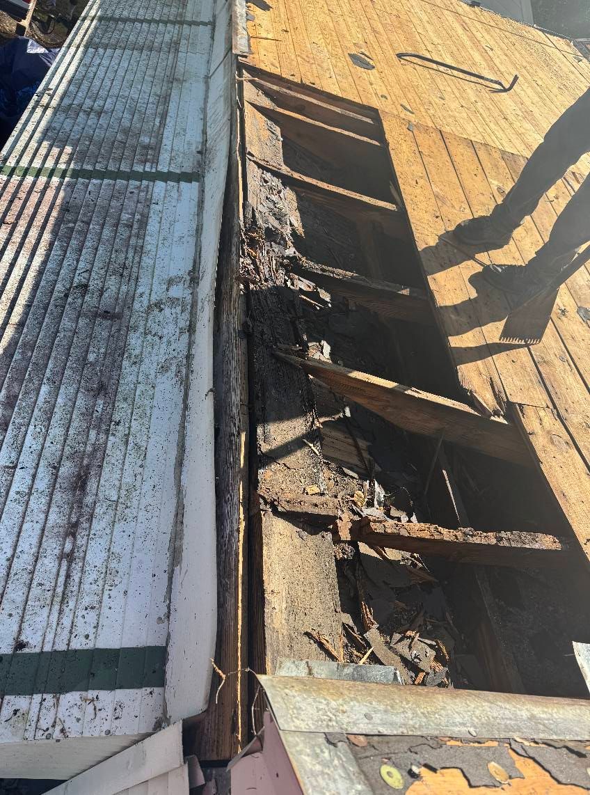 A close up of a roof with a lot of damage on it.