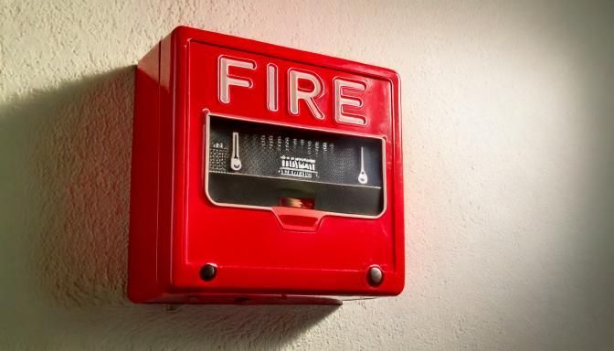 malfunctioning fire alarm in office building