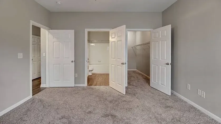 Bedroom with a view of the bathroom and walk-in closet at Woodland Pointe in Nashville, TN.