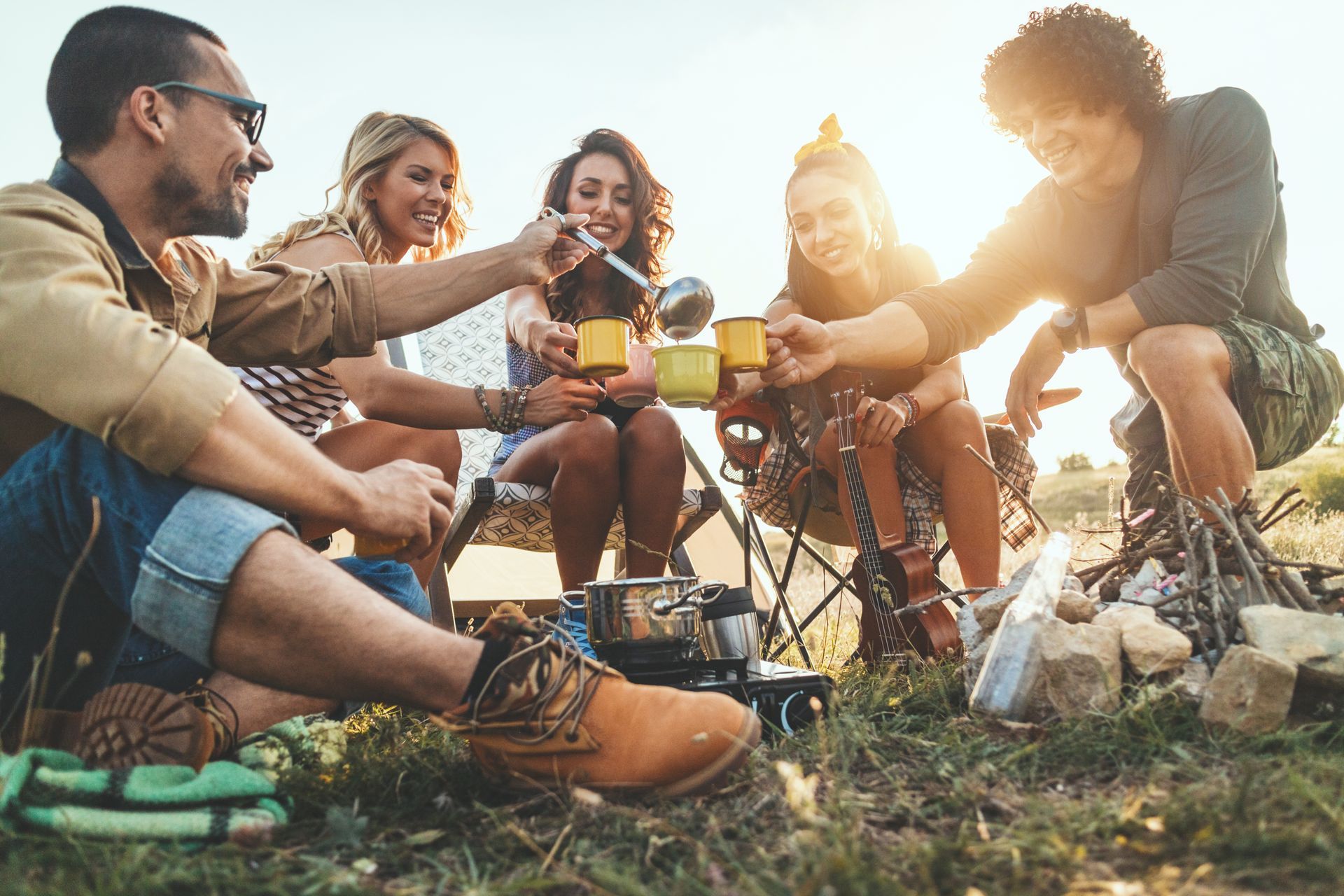 friends sharing around a campfire with rental camping gear, enjoying a stress-free o