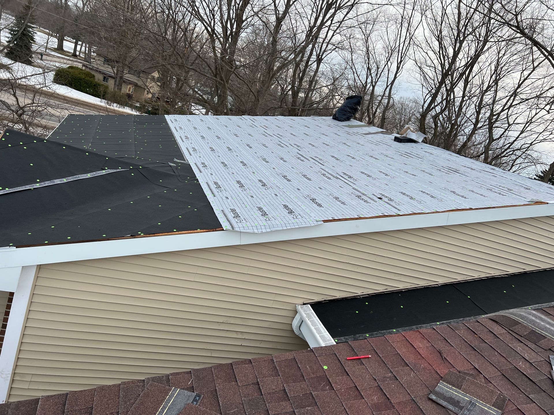Single-story home in Gaylord, MI with underlayment for a new roof replacement.