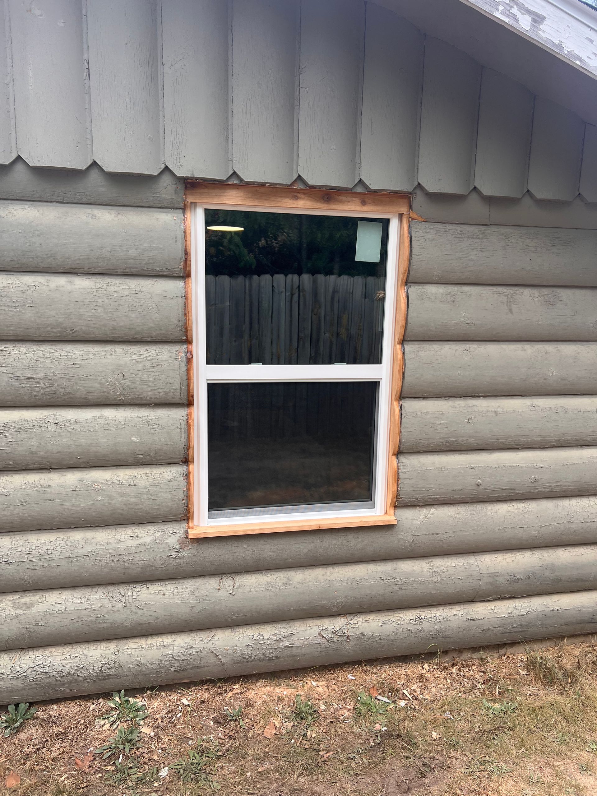A closeup image of a window installation by Alpine Brothers Construction