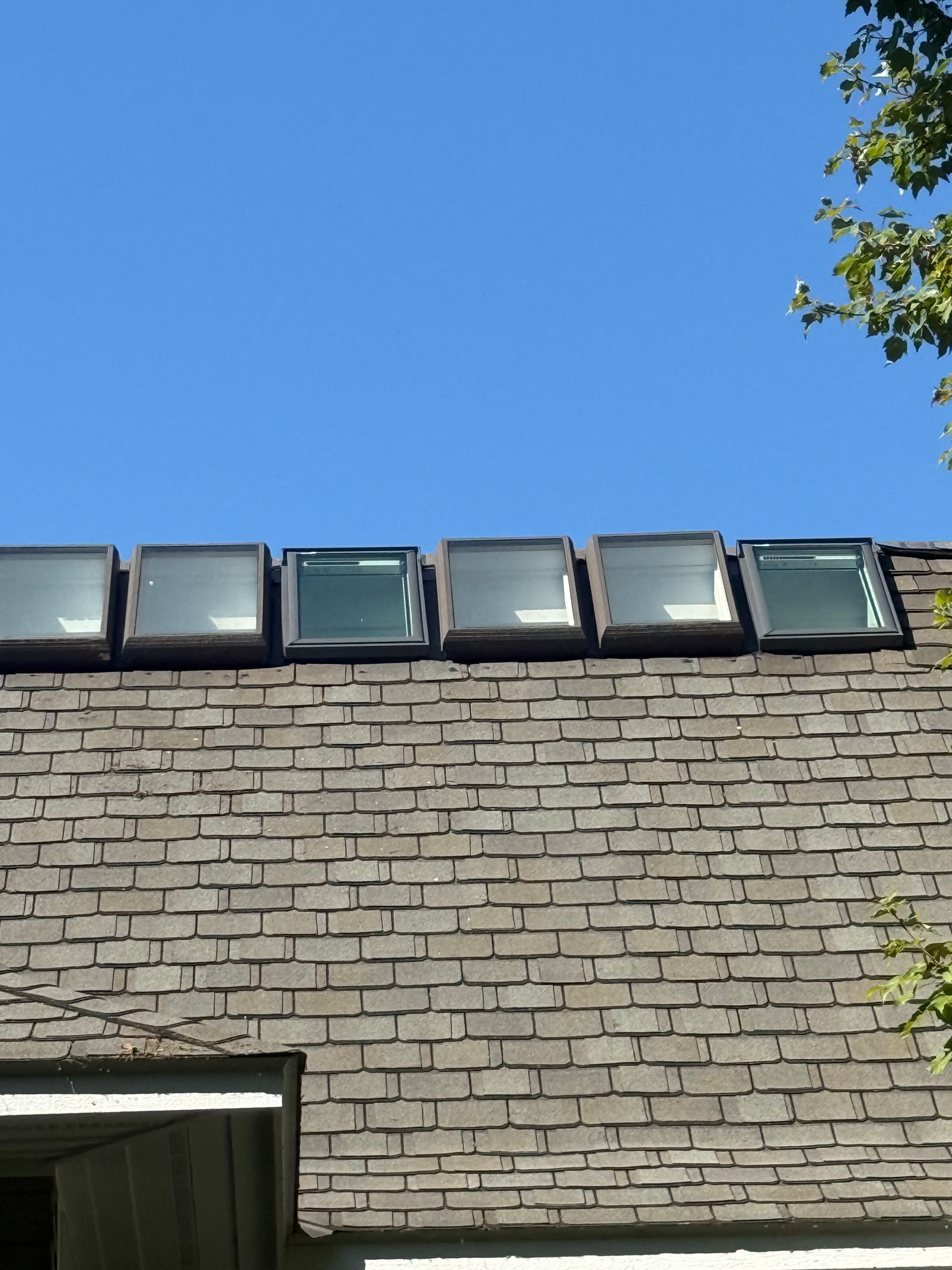 Asphalt shingle roof with 6 skylight windows installed