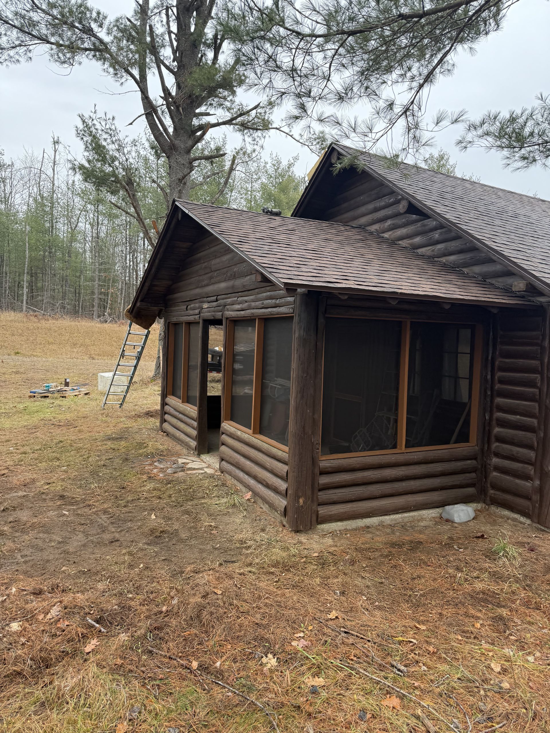 A wooden house with a new asphalt roof in Gaylord, MI