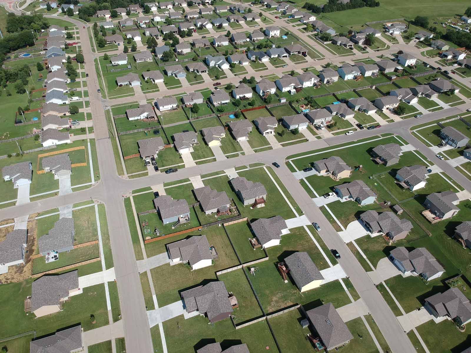 An aerial view of a residential neighborhood with lots of houses