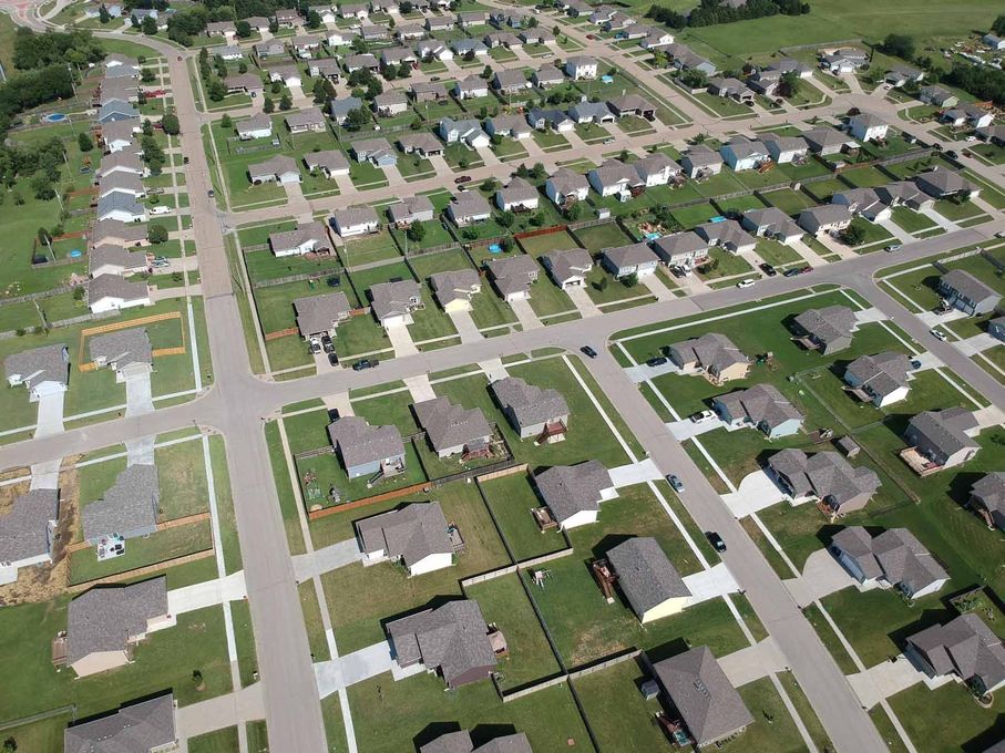 An aerial view of a residential neighborhood with lots of houses