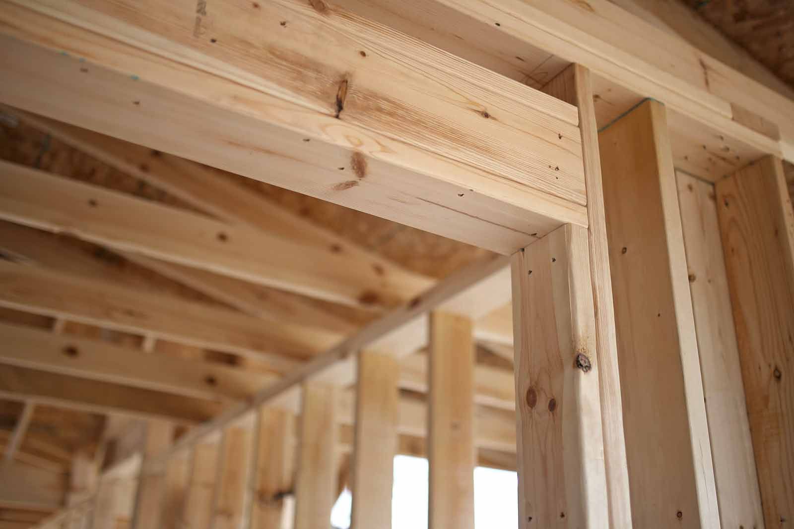 A close up of a wooden structure under construction.