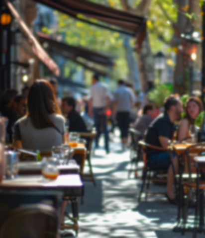 Stock photo of people eating dining on sidewalk patio tables