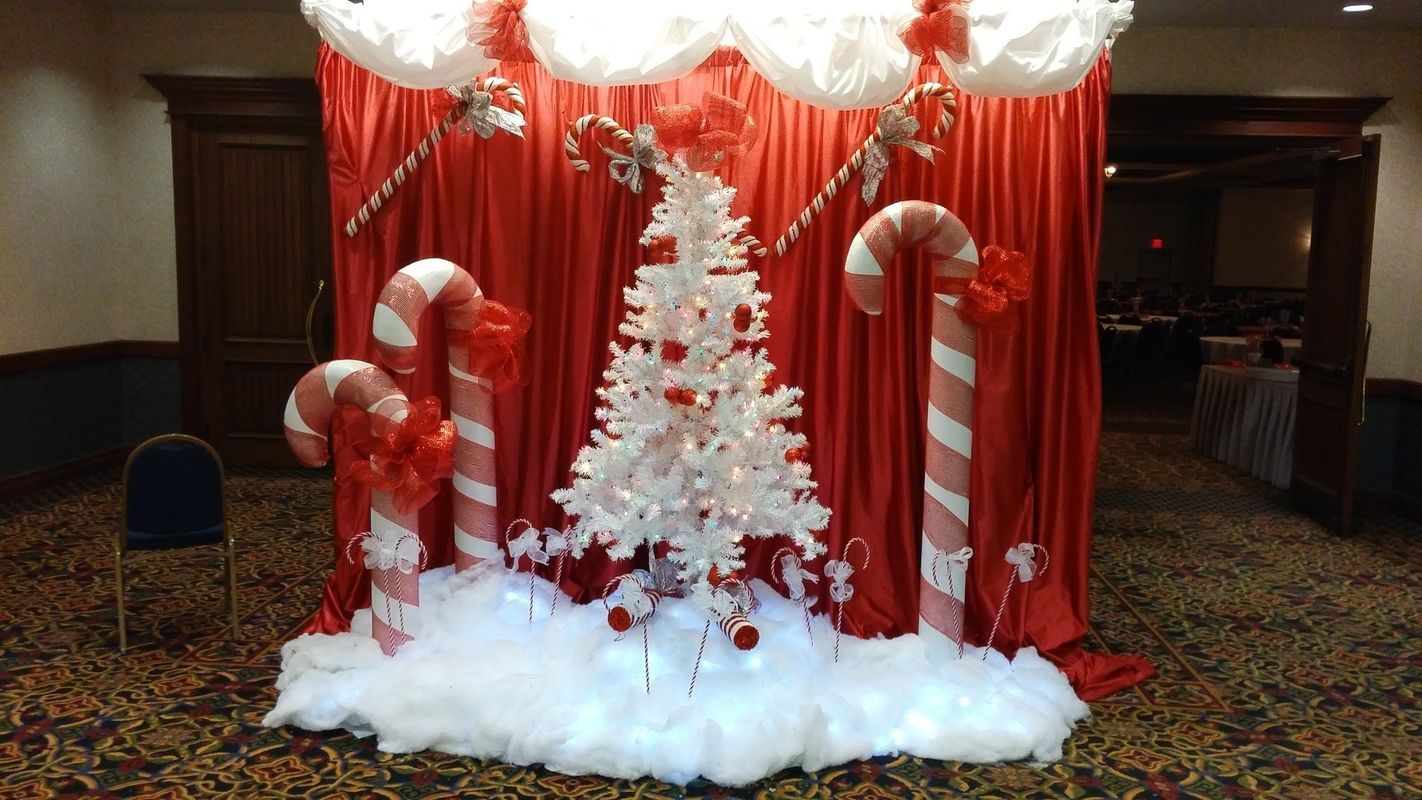 A room decorated for christmas with candy canes and a christmas tree