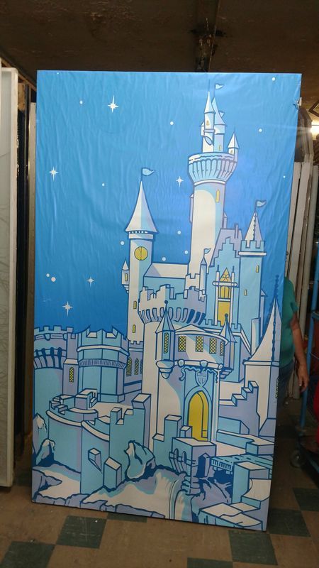 A painting of a castle on a blue background