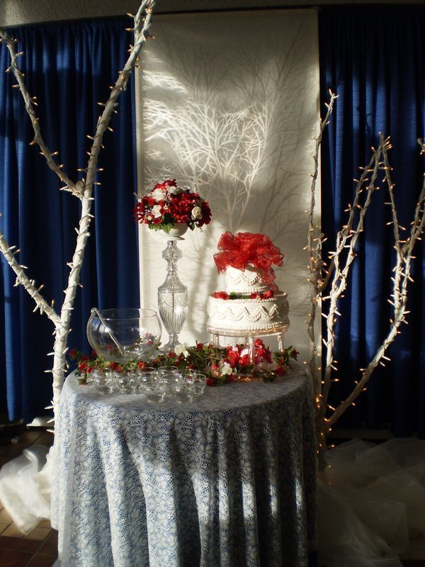 A table with a cake and flowers on it