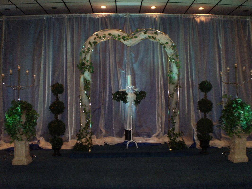 There is a heart shaped arch in the middle of the room