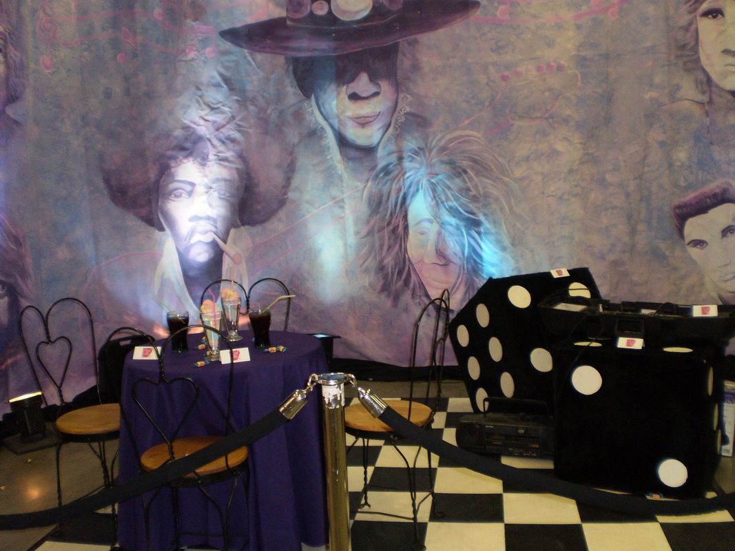 A room with a table and chairs and a large dice