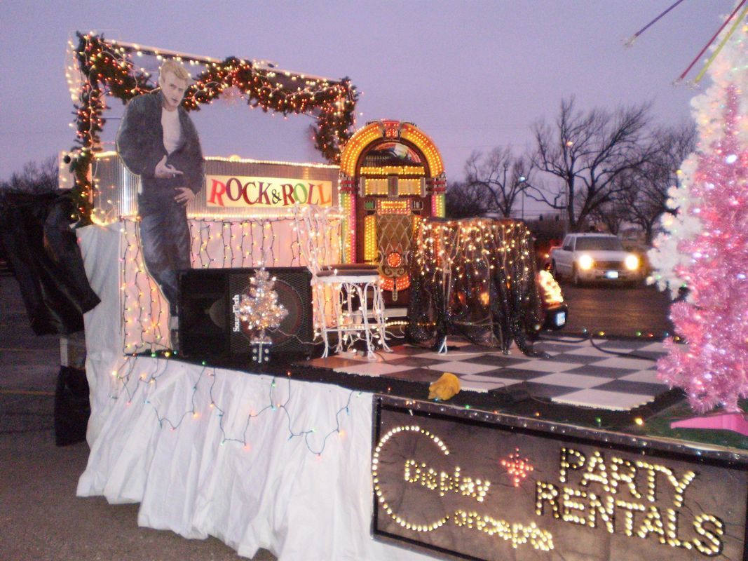 A float with a sign that says party rentals