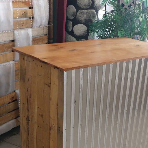 A wooden table with a metal frame and a wooden top