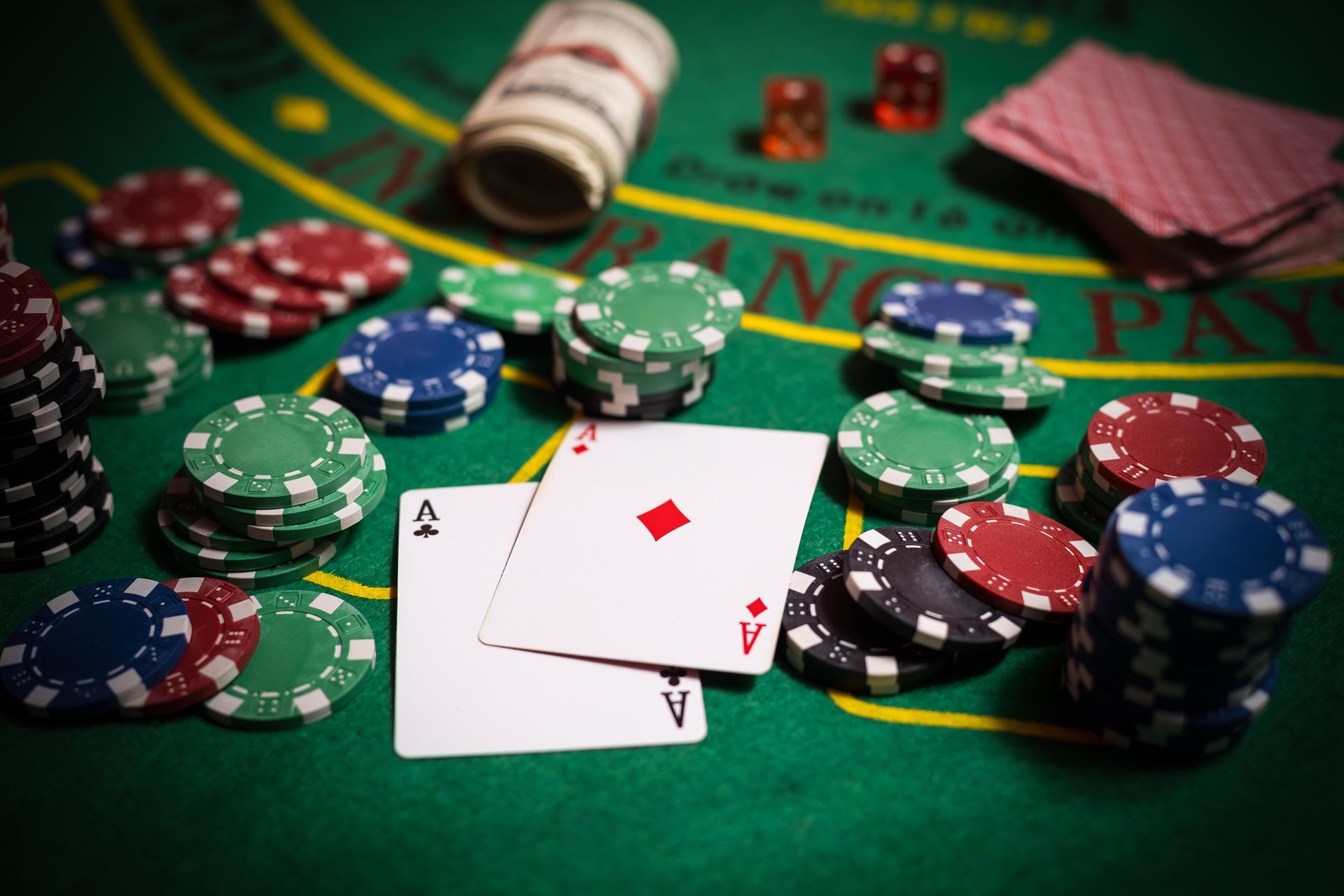 A poker table with chips and playing cards on it