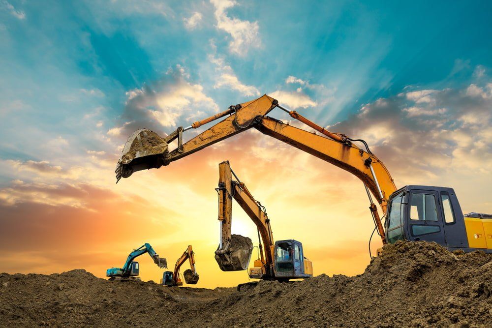 Four Excavators Works On Construction Site — Plant Hire in Rockhampton, QLD
