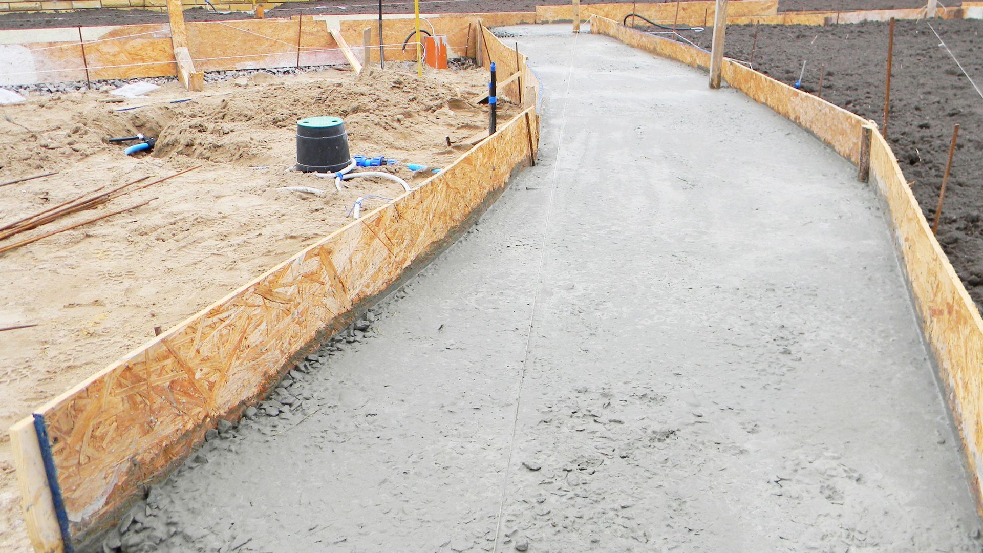 A concrete walkway with concrete ready mixed on site from a volumatic concrete wagon from PureMix Concrete Rochdale