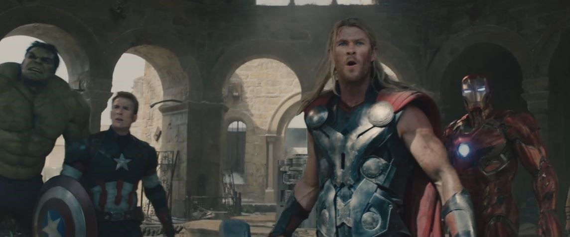 the hulk, captain america, thor, and iron man looking into the distance in disbelief