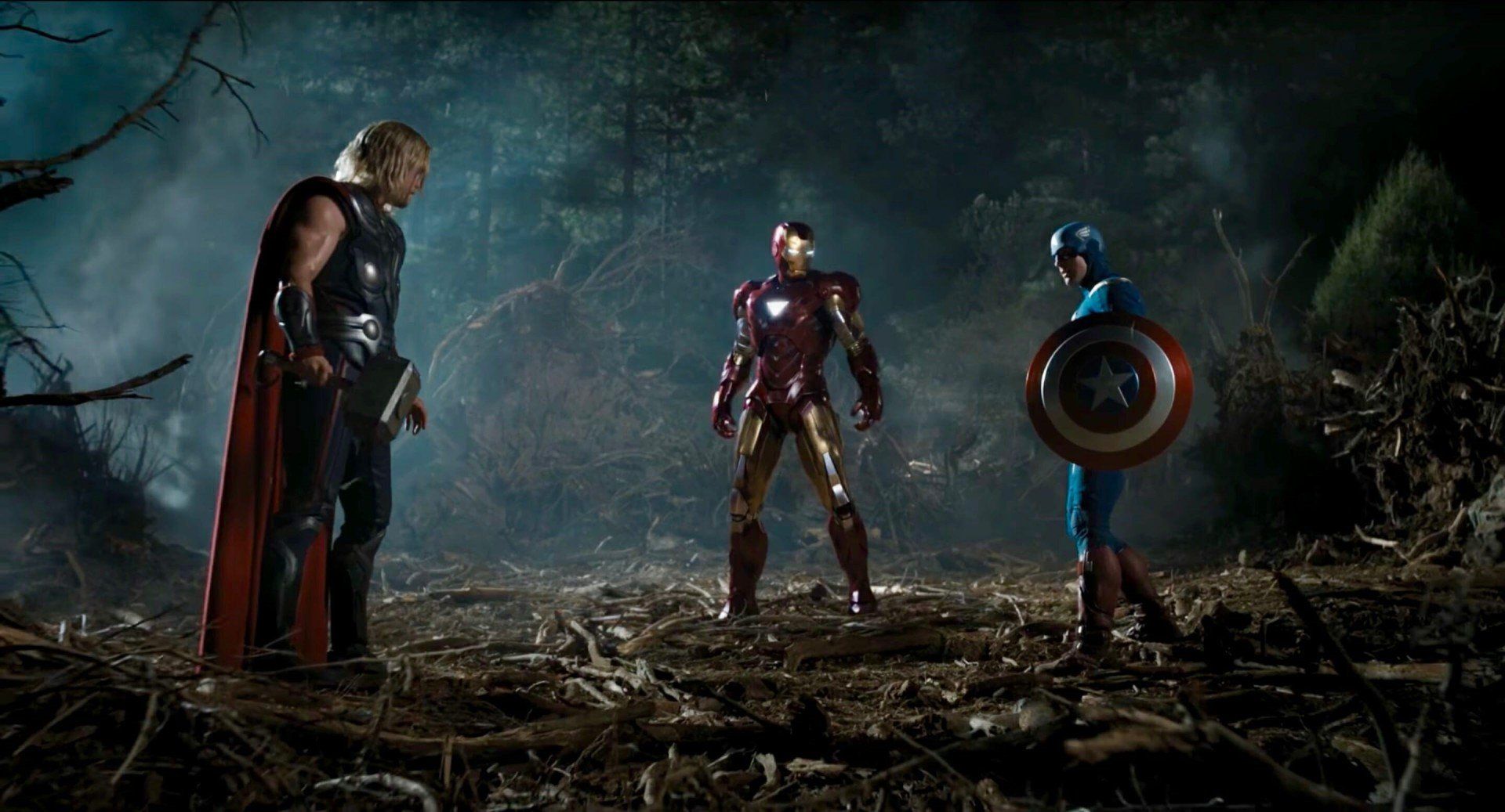 thor, iron man, and captain america facing off in a forest