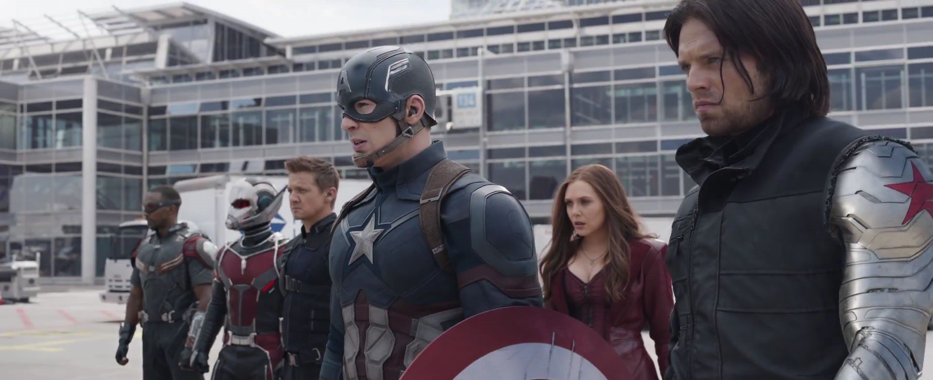 captain america, hawkeye, antman, winter soldier, falcon, and scarlet witch ready to fight on an airport runway