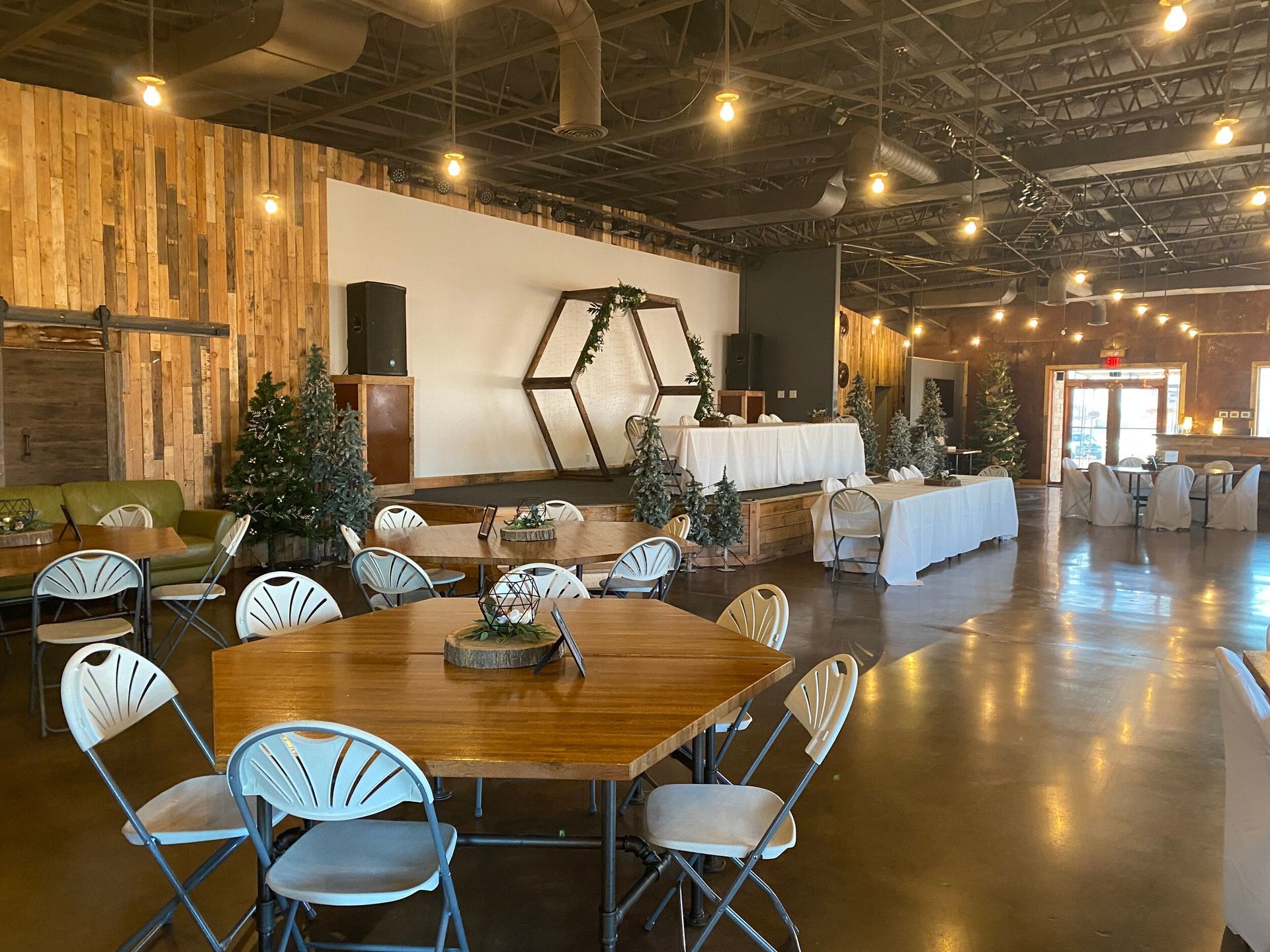 A large room with tables and chairs in it.