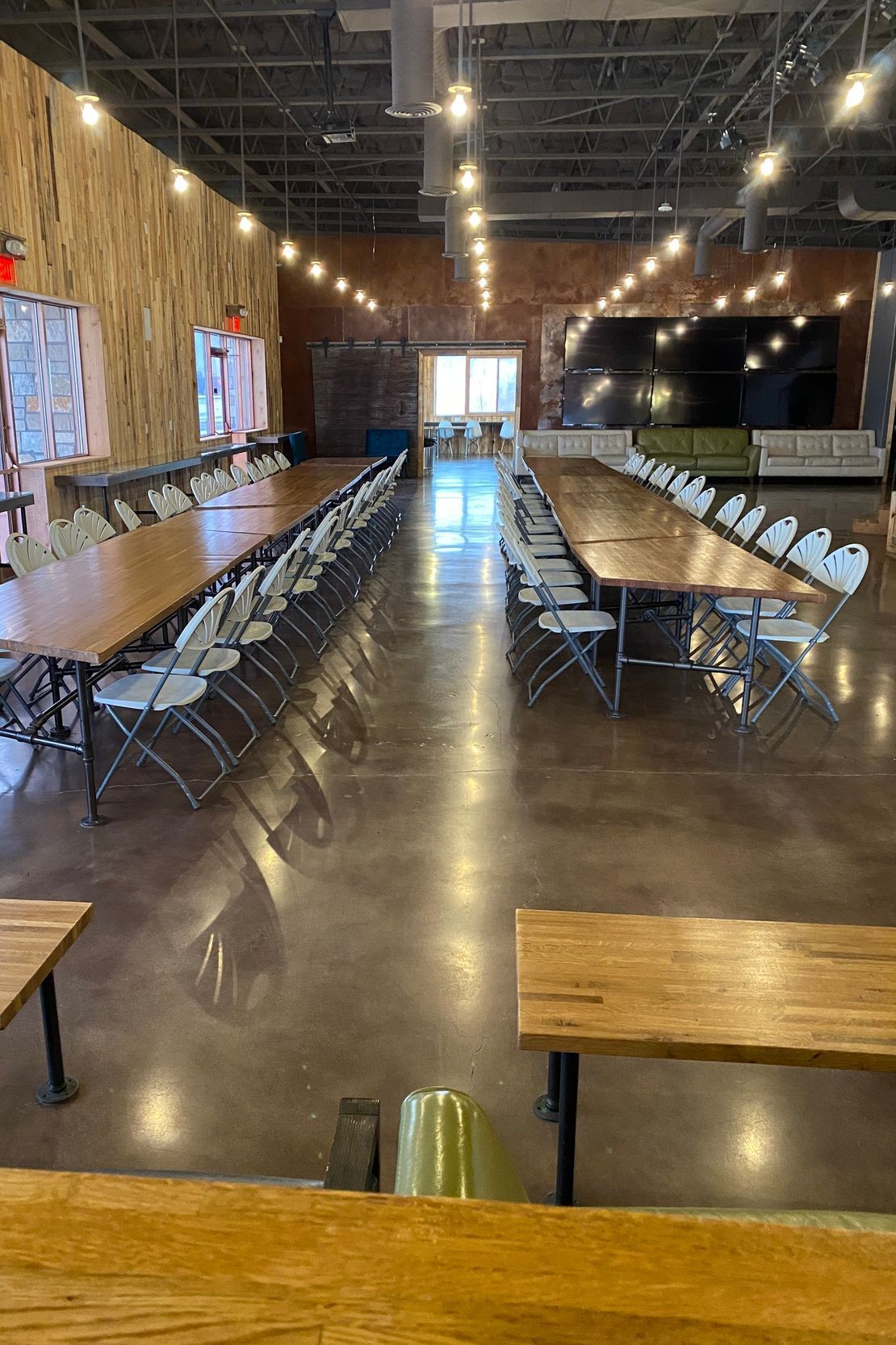 There are a lot of tables and chairs in this room.