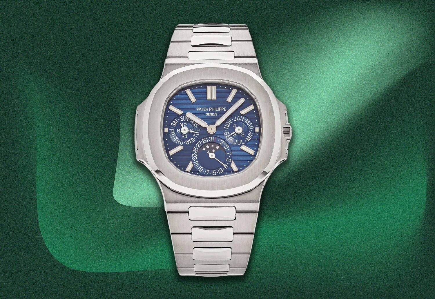Silver Patek Philippe Nautilus watch with a blue textured dial and integrated bracelet.