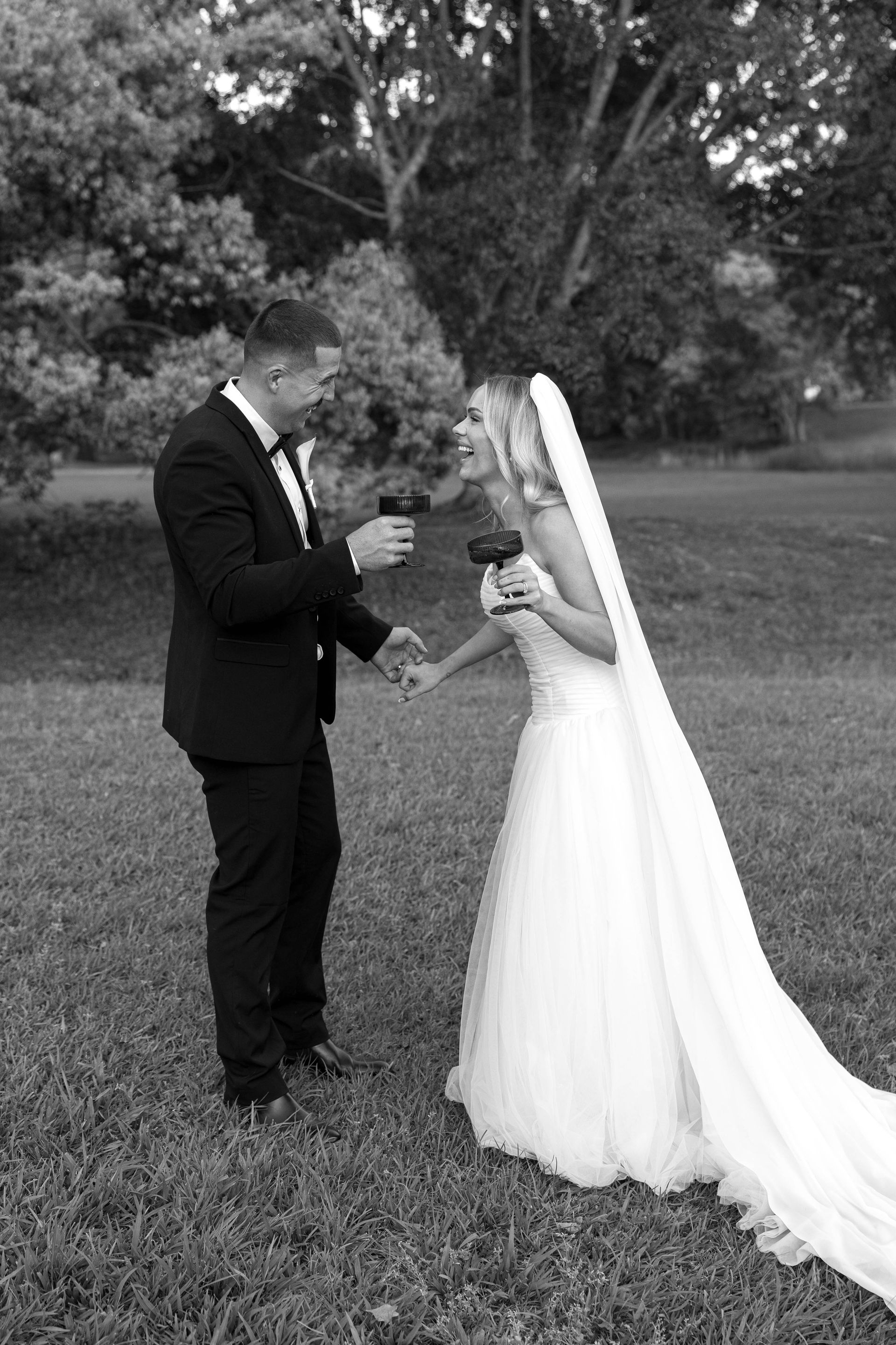 A man and a woman are standing next to each other on a checkered floor.