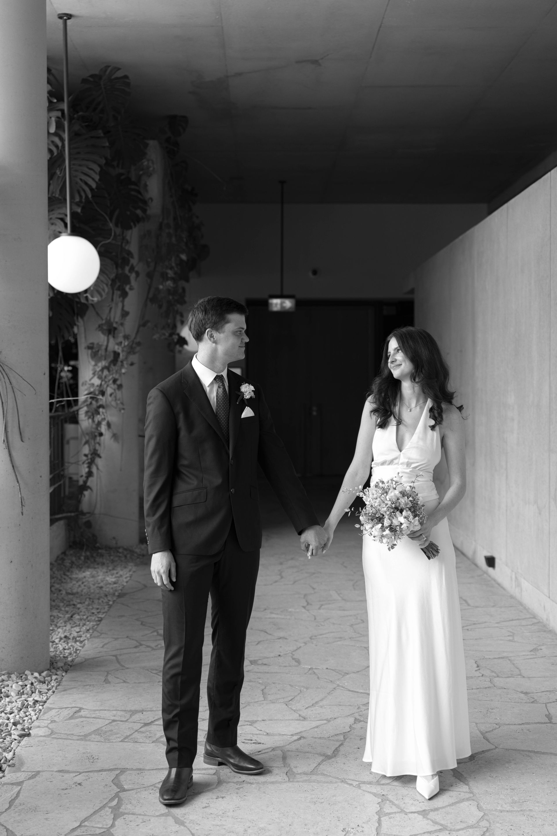 A man and a woman are standing next to each other on a checkered floor.