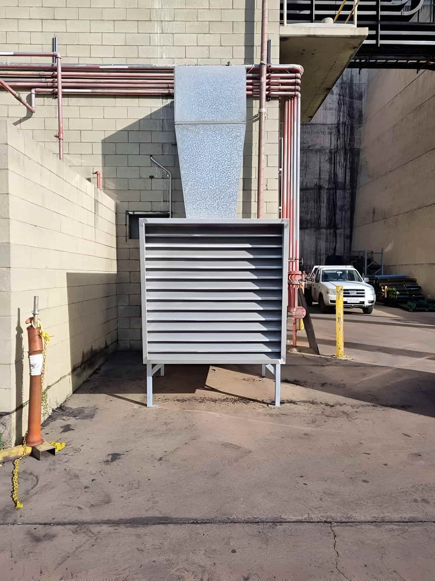 A White Truck Is Parked In A Parking Lot Next To A Building — Gladstone Sheet Metal Pty Ltd In Gladstone Central, QLD