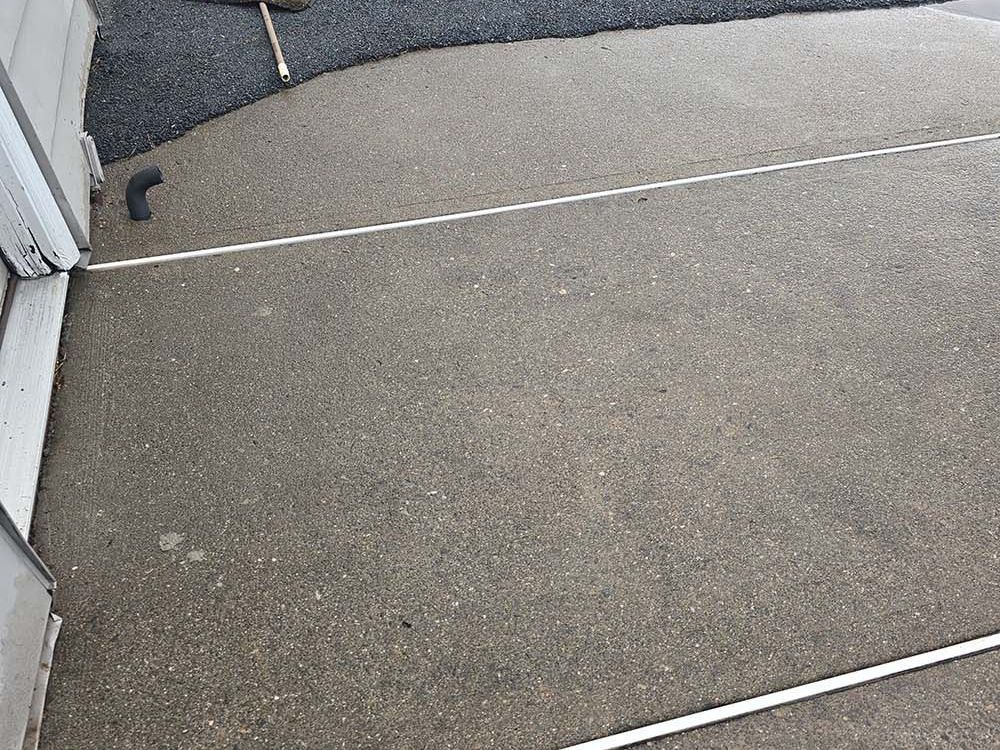 Leveled Concrete patio using polyurethane foam lifting.