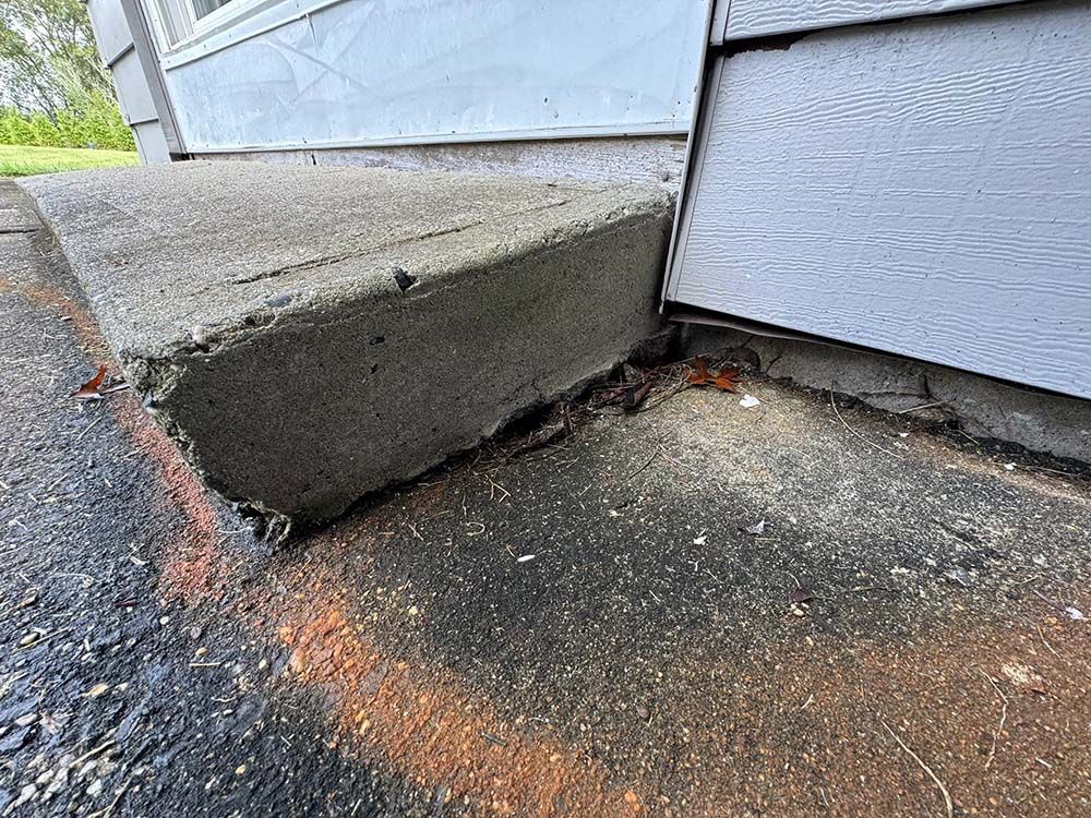 Uneven concrete step before foam lifting