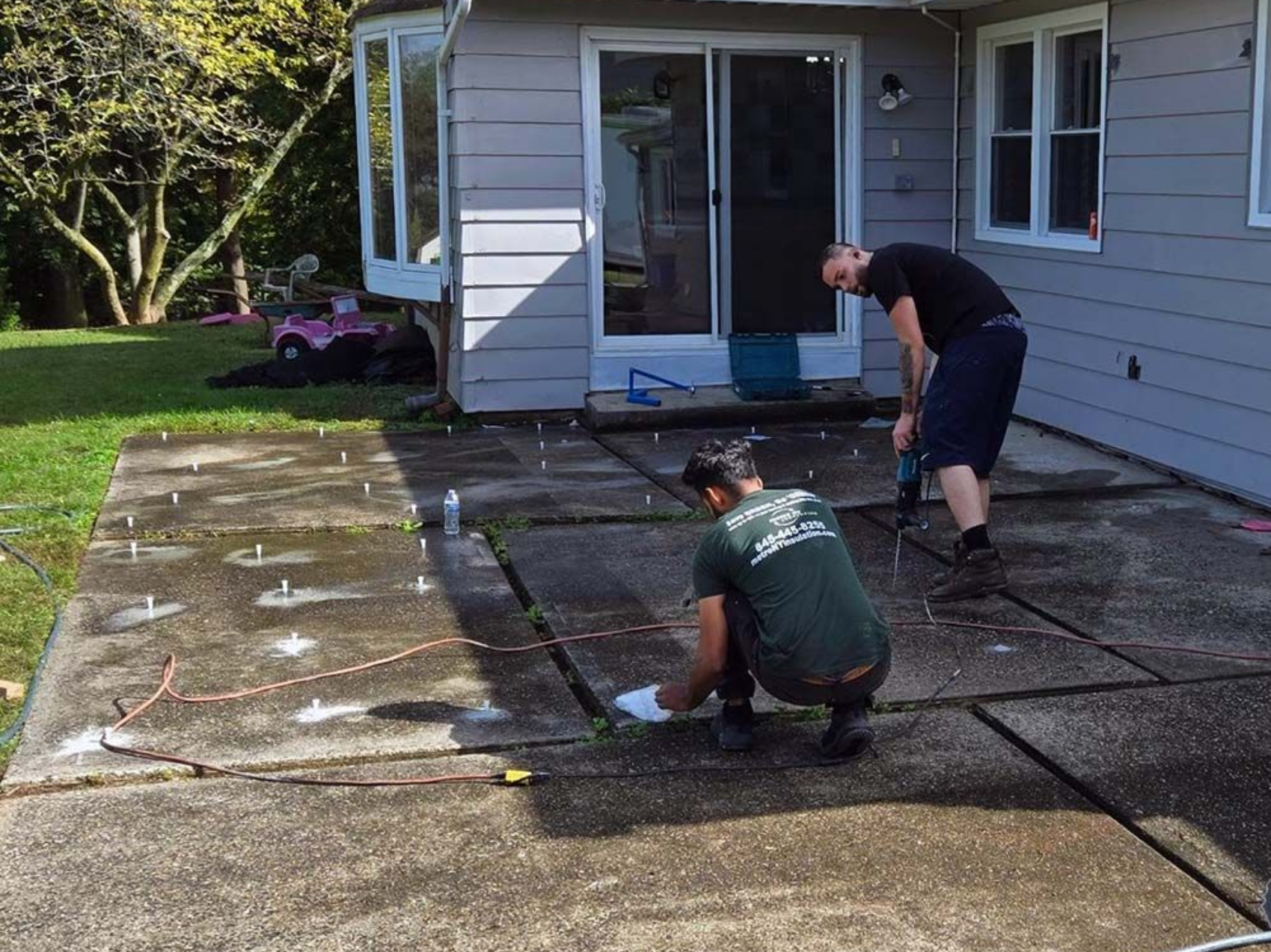polyurethane foam lifting to level a patio at a home. 