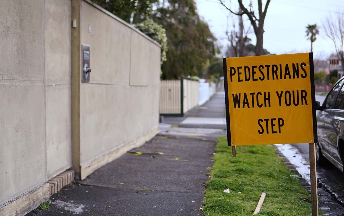 Uneven sidewalk with visible trip hazard in New Jersey or Westchester