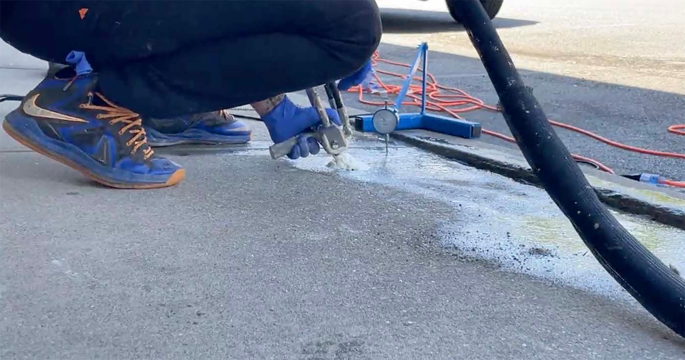 Does foam concrete leveling work? - Technician performing foam concrete lifting in NJ