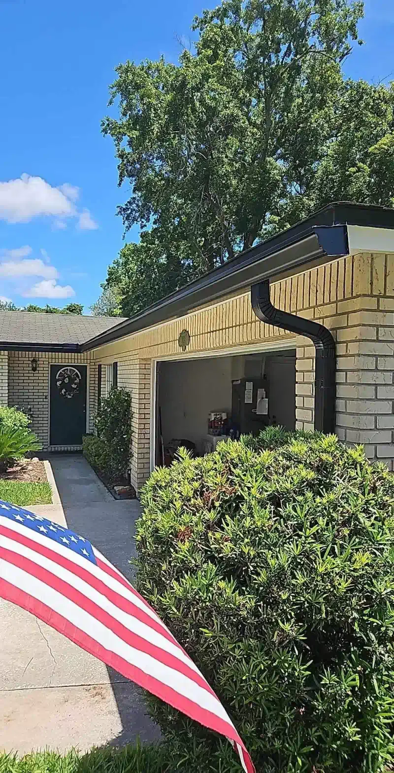 A house with an american flag in front of it.