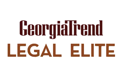The logo for georgia trend legal elite is brown and white.