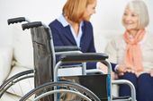 carer taking care of a disabled woman