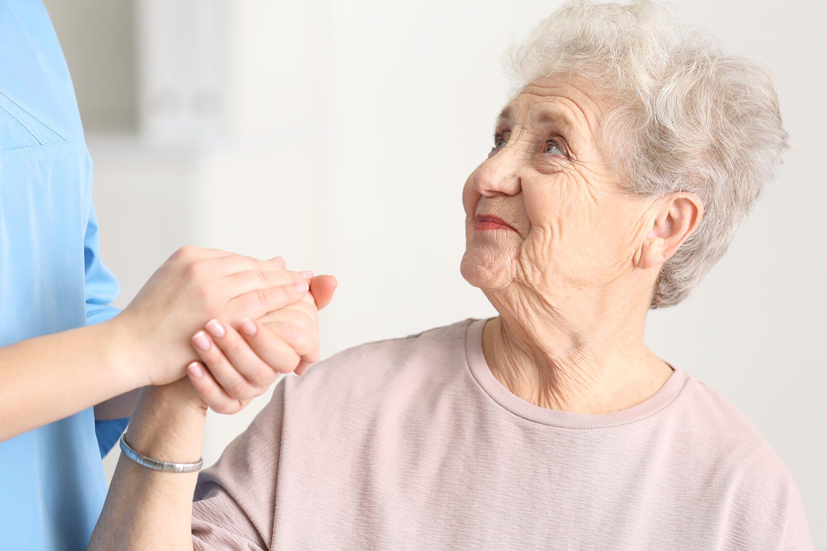 photo of an elderly woman being taken care of at home
