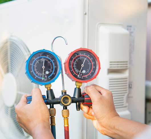 Worker Checking the Air Condition — Zachary, LA — Hughes Mechanical Contractors Worker Checking the Air Condition — Zachary, LA — Hughes Mechanical Contractors