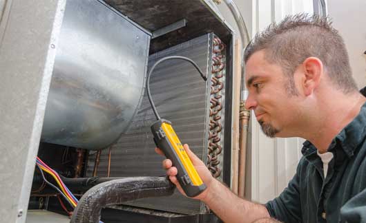 HVAC Technician with Leak Detector — Zachary, LA — Hughes Mechanical Contractors