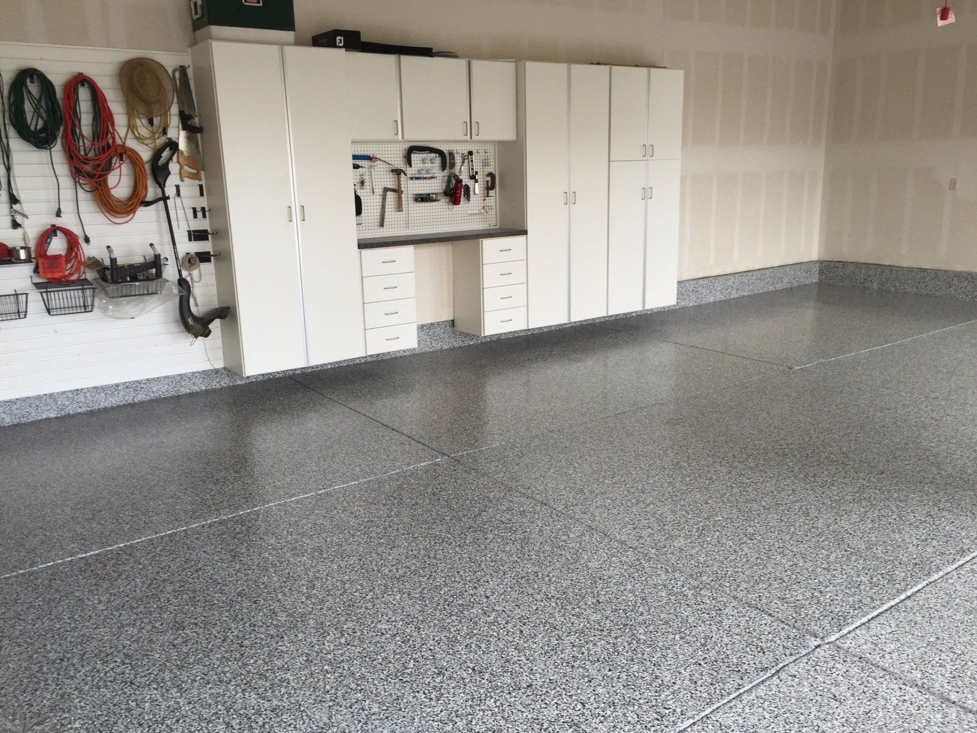 garage epoxy floor with cabinets