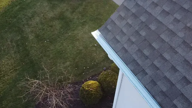 An aerial view of a house with a roof and a gutter.
