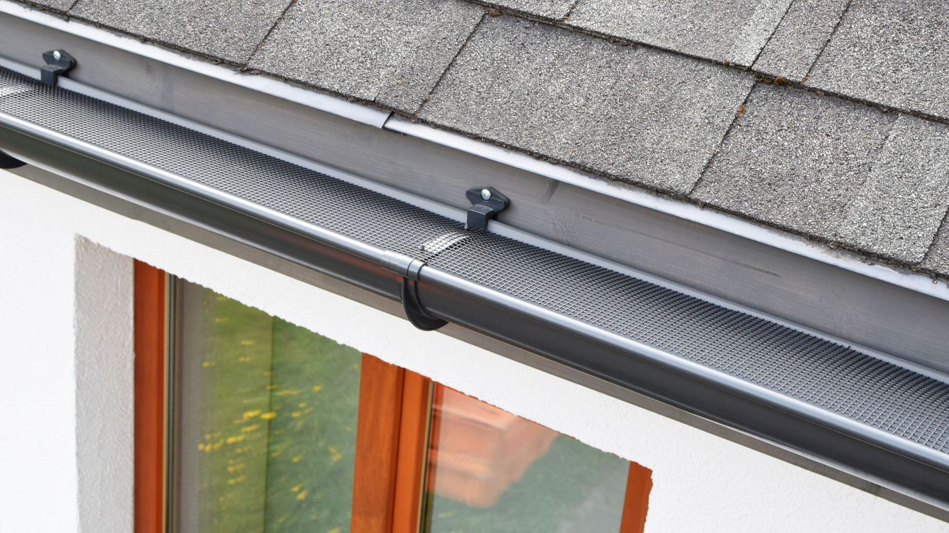A row of houses with a blue sky in the background.
