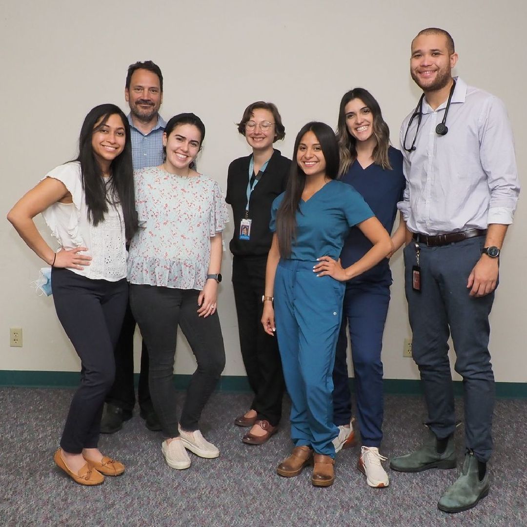 A group of people are posing for a picture together